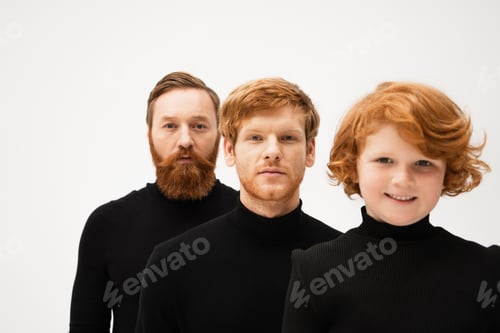 Preview: bearded man in black turtleneck looking at camera near redhead son and happy grandson isolated on