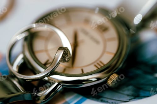 Preview: Close-Up of Wedding Rings and Watch Timepiece