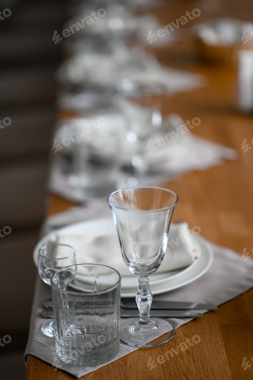 Preview: Festive romantic table setting with silverware, gray napkin and white crockery