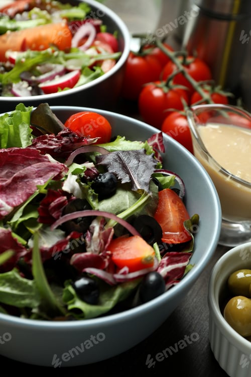 Preview: Concept of tasty food with vegetable salad with tahini sauce close up