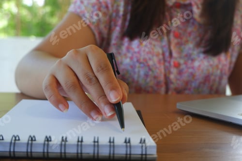 Preview: Close-up female hand writing. Student studying, working, reading, tutoring