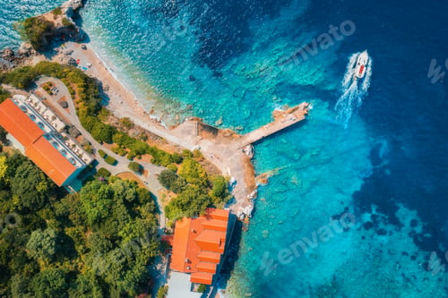 Preview: Aerial view of sea coast with clear blue water and boat