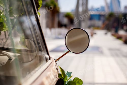 Preview: Dubai, April 2019 Closeup of a mirror on a gray vintage car