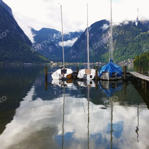 Preview: Sailboats Docked by Scenic Mountain Lake