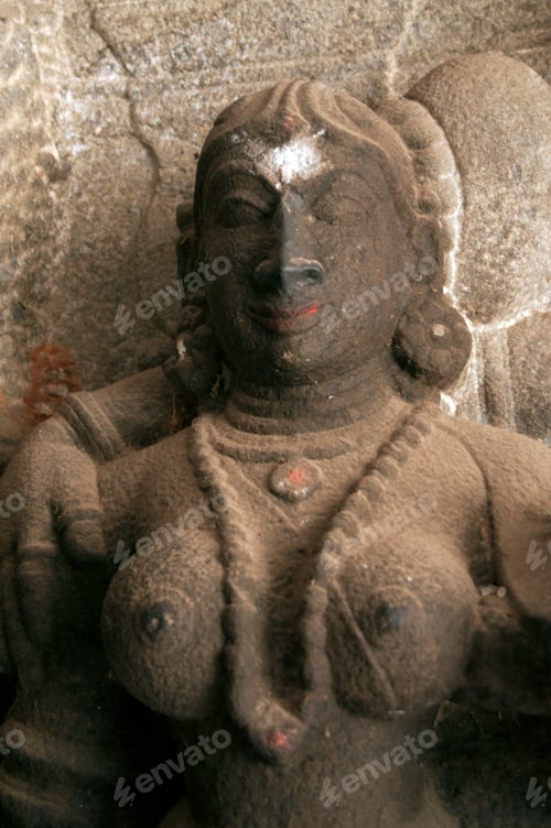 Preview: Spiritual stone statue of hindu god in ancient temple, India.