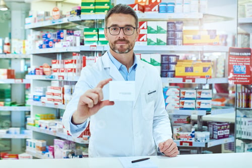 Preview: Cropped portrait of a handsome mature male pharmacist working in a pharmacy