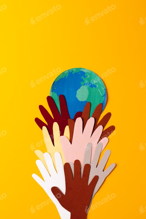 Preview: Paper cut out of multi coloured hands and globe with copy space on yellow background