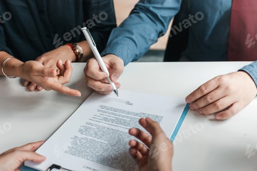 Preview: Businessman sign the contract agreement on the document. Signing of a contract to buy or sell busine