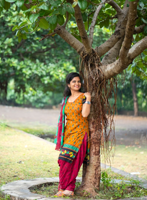 Preview: Beautiful girl between nature full of branches of tree.