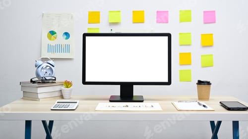 Preview: Office desk, Blank screen display computer with graph, calculator, smartphone on the desk.