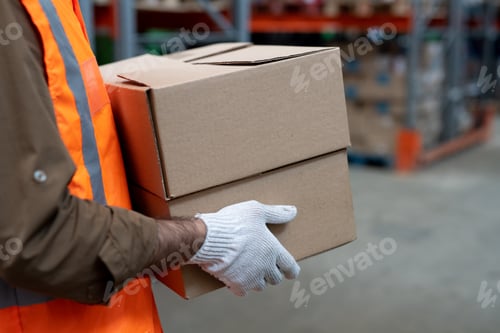 Preview: Gloved loader carrying two boxes