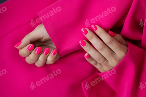 Preview: Beautiful pink manicure on a woman's hand, close-up