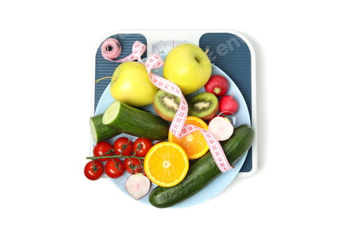 Preview: Scales, measuring tape and vegetarian food isolated on white background