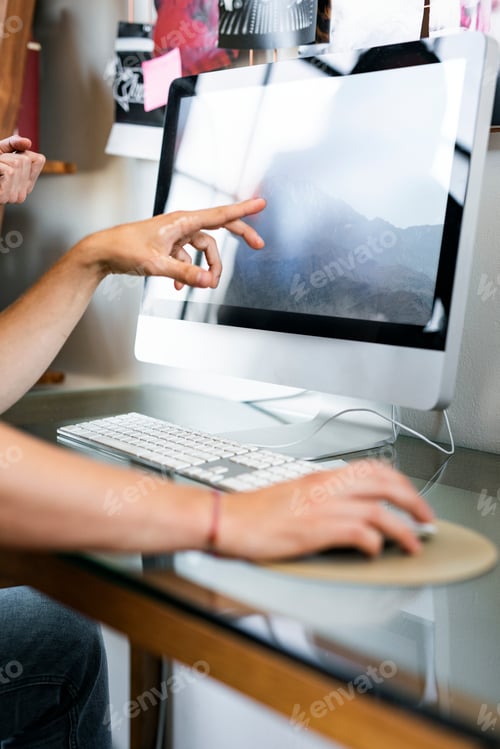 Preview: Coworker showing computer screen