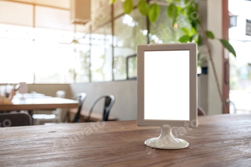Preview: A blank menu sign on wooden table in cafe