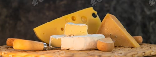 Preview: Cheese is on the table. Selective focus.