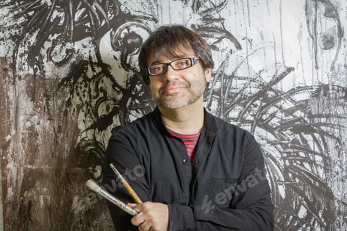 Preview: Painter artist posing in front of paint