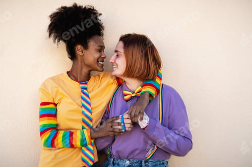 Preview: Happy women gay couple having tender moments outdoor - LGBTQ and love concept