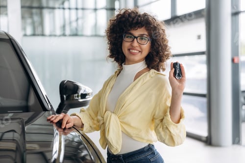 Preview: In casual clothes, standing by the vehicle. Pretty woman is in the car retail shop