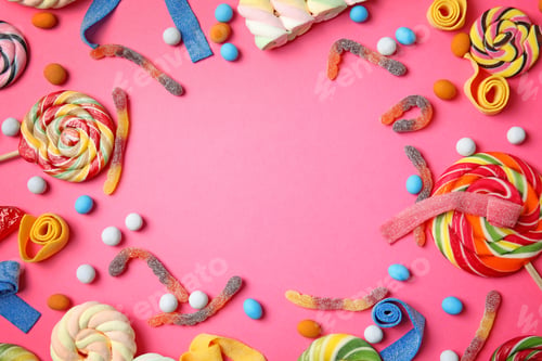 Preview: Flat lay composition with different yummy candies and space for text on color background