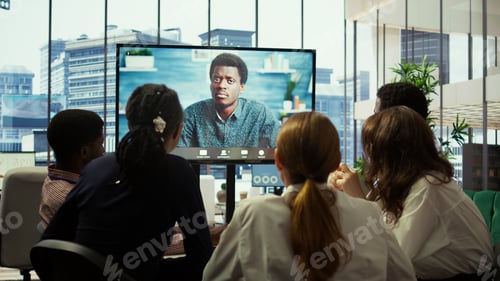 Preview: CEO leading a meeting on online teleconference call in the boardroom