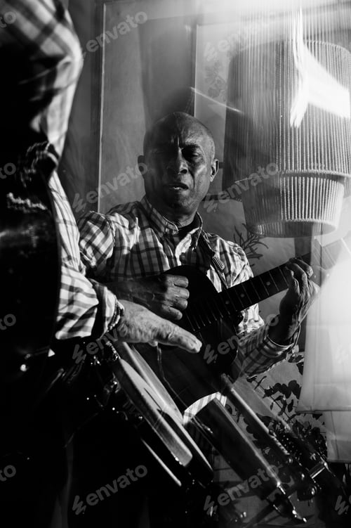 Preview: musician playing guitar in in the night club