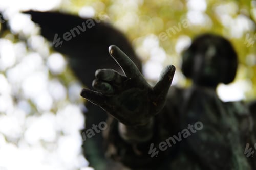 Preview: Closeup of the bronze statue of an angel. Hand selected focus.