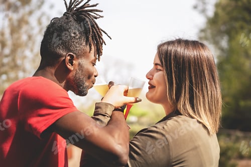 Preview: Interracial couple celebrating outdoors