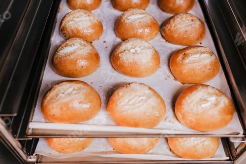 Preview: close up view of bread on strays ready to bake in the oven. bakery concept