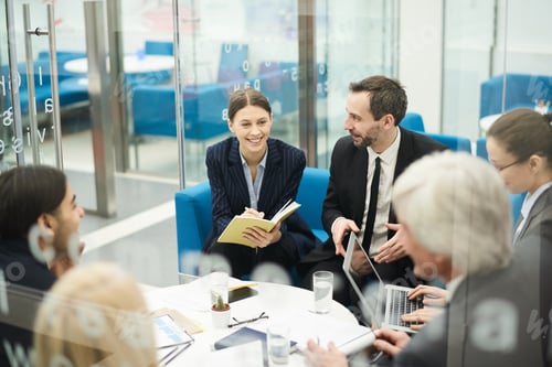 Preview: Cheerful Businesswoman in Meeting