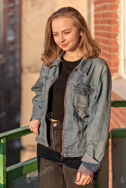 Preview: Woman Posing Outside Wearing a Denim Jacket