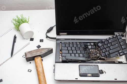 Preview: man destroyed laptop with a hammer. Nervous work, buggy computer, errors, slow Internet, not saved