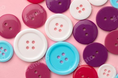 Preview: Plastic buttons on pink pastel background top view