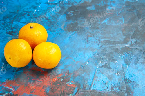 Preview: front view fresh tangerines on the blue background color citrus fruit photo juice tree ripe