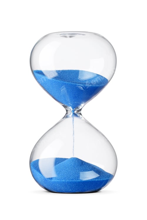 Preview: Hourglass with blue sand measuring time on white background.