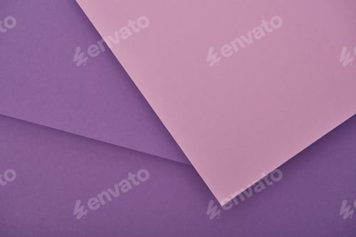 Preview: top view of lilac and violet laid out paper sheets with copy space