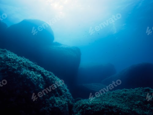 Preview: background of a rocky seabed at turquoise blue sea
