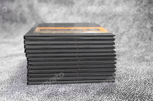 Preview: photo albums are stacked on gray background.