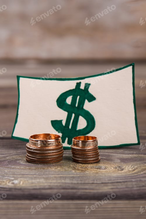Preview: Stacks of Coins with Dollar Sign on Wood