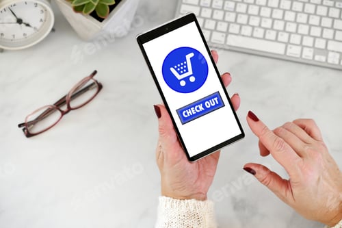 Preview: Female using cell phone to shop online - blue shopping cart with checkout check out button