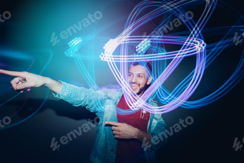 Preview: Handsome bearded man dancing in spotlight