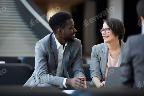 Preview: Cheerful business colleagues brainstorming about project