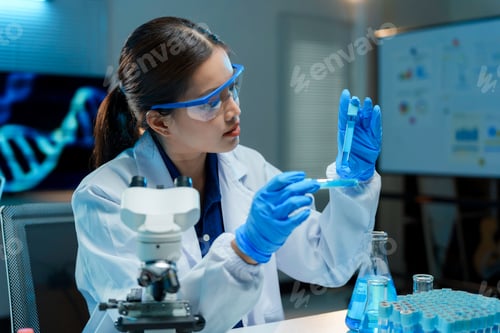 Preview: Female scientist analyzing liquid in medical laboratory