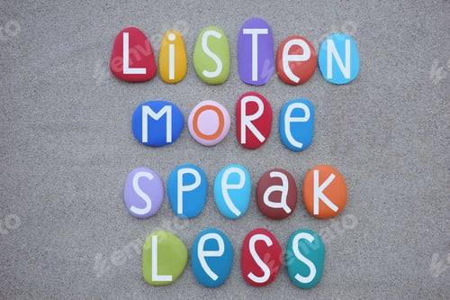 Preview: Listen more, speak less, lifestyle quote composed with multi colored stone letters over natural beac