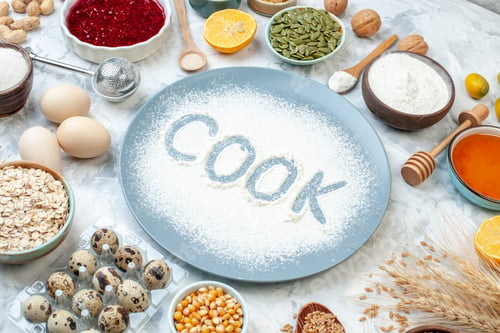 Preview: front view white flour inside plate with nuts seeds and eggs on white background nut dough bake food