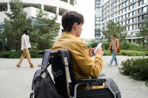 Preview: Man with disability using smartphone