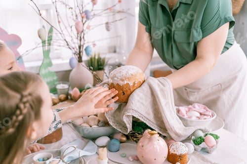 Preview: happy easter holiday time in spring season. beautiful young housewife woman holds a freshly baked pa