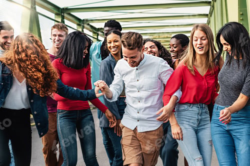 Preview: Multiethnic people having fun walking together carefree