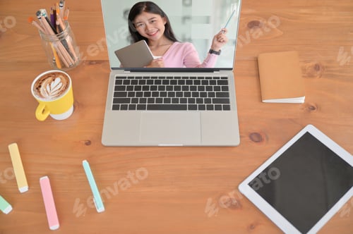 Preview: Young Woman Teaching Online in Home Office