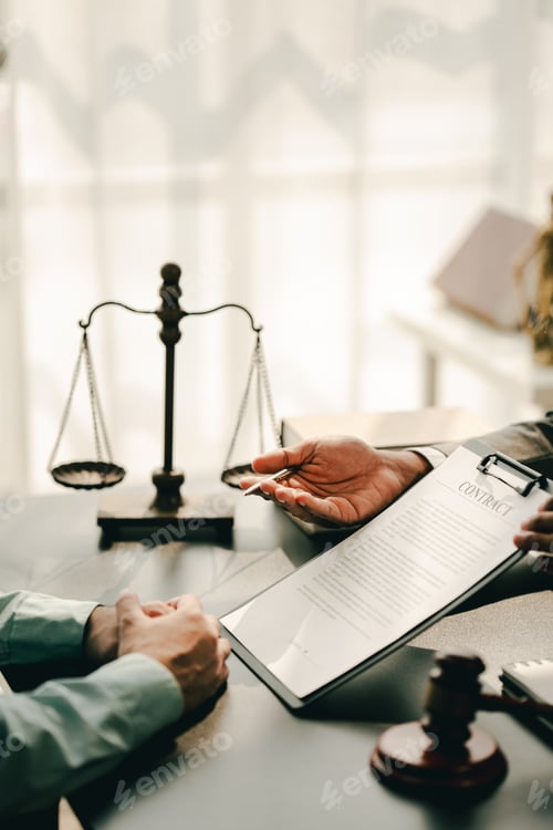 Preview: concept of justice and law A male judge in the courtroom on a wooden table and a male counselor